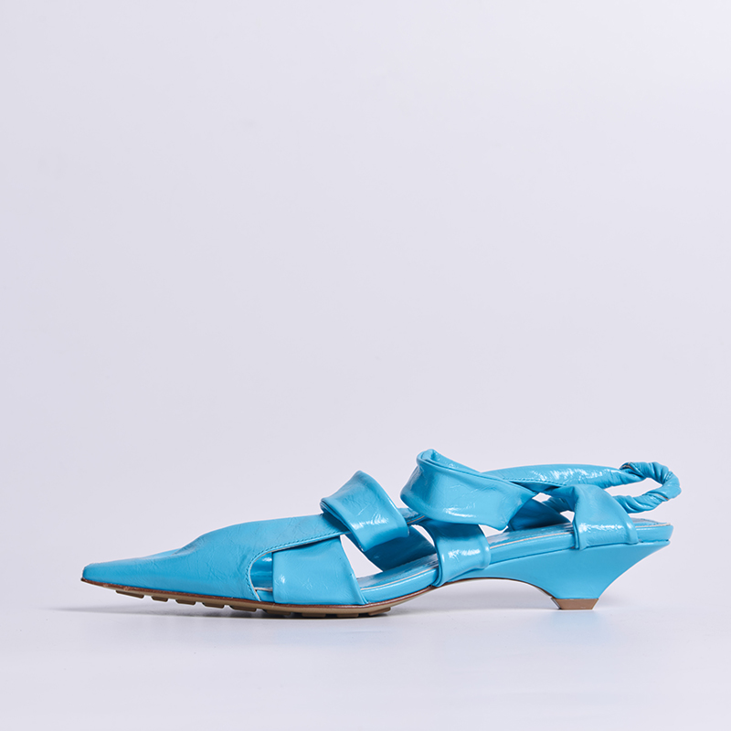 Women’s low heel with asymmetric sculptural detailing and refined leather upper developed for experimental designer footwear collections