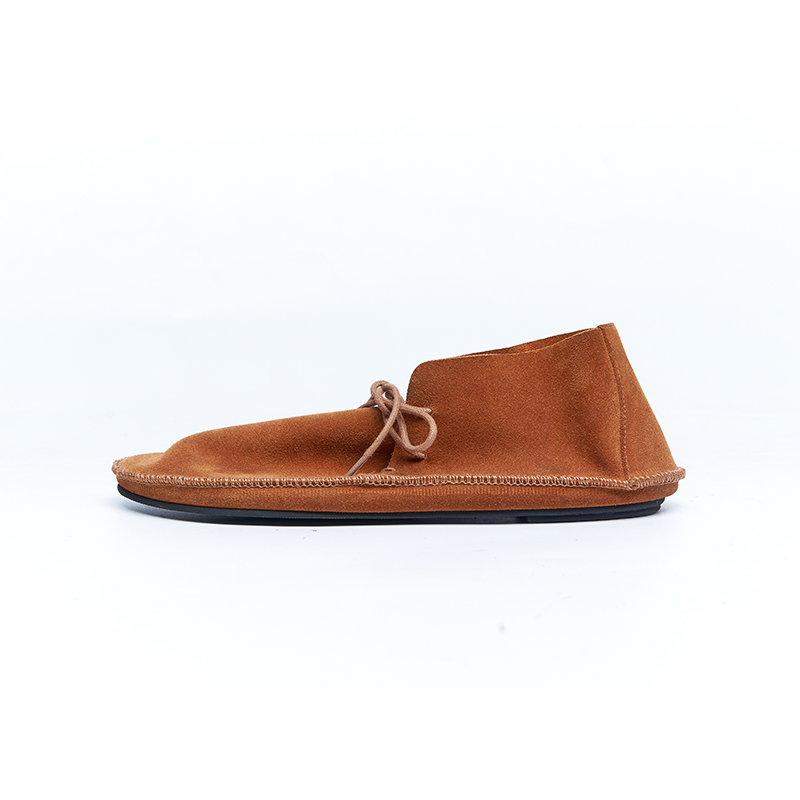 Brown suede loafer with relaxed moccasin-inspired construction and flexible sole for casual designer footwear lines