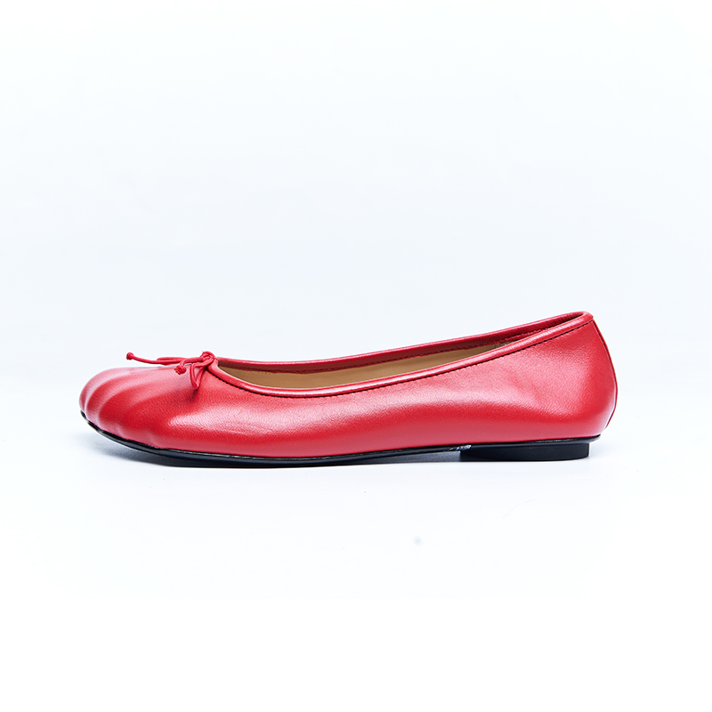 Red leather ballet flat with soft rounded toe and refined upper construction for designer flat shoe development