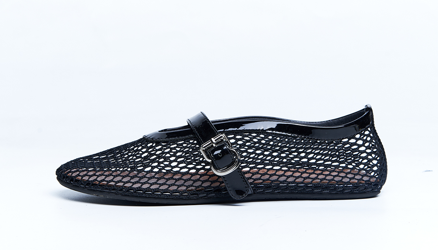 Black mesh leather flat with Mary Jane strap detail and breathable woven upper, developed for fashion-forward women’s footwear collections