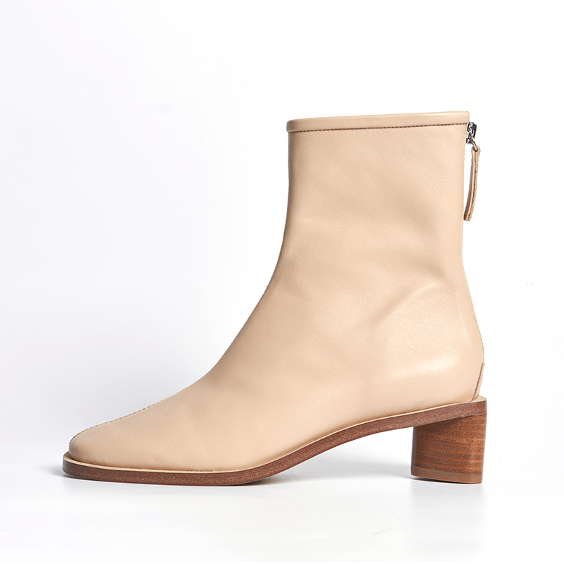 Beige leather ankle boots with slim heel and elegant feminine silhouette for designer brands OEM ODM