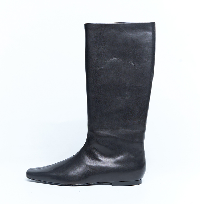 Black leather tall boots with clean lines and minimal construction for designer brand OEM ODM production