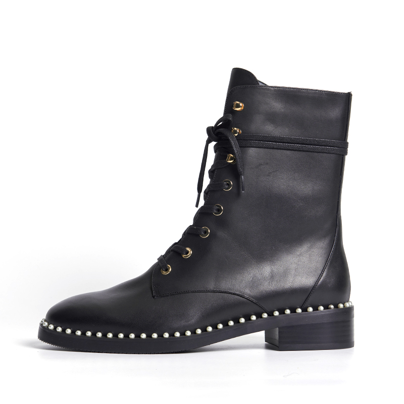 Black leather ankle boots with metal stud detailing and bold fashion attitude for designer OEM ODM