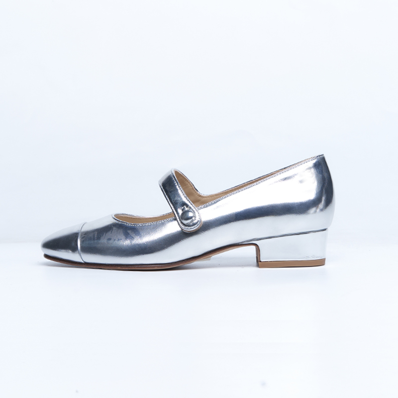 Women’s Mary Jane low heel with metallic leather finish and classic strap structure reinterpreted for modern designer brands