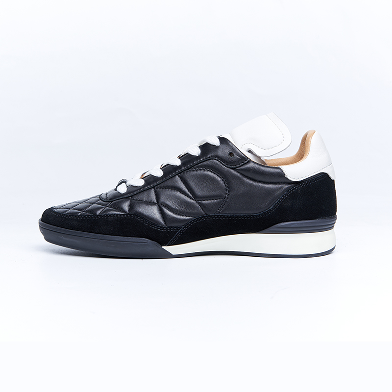 Black leather low-top sneakers with clean silhouette and flexible outsole, premium OEM ODM footwear development