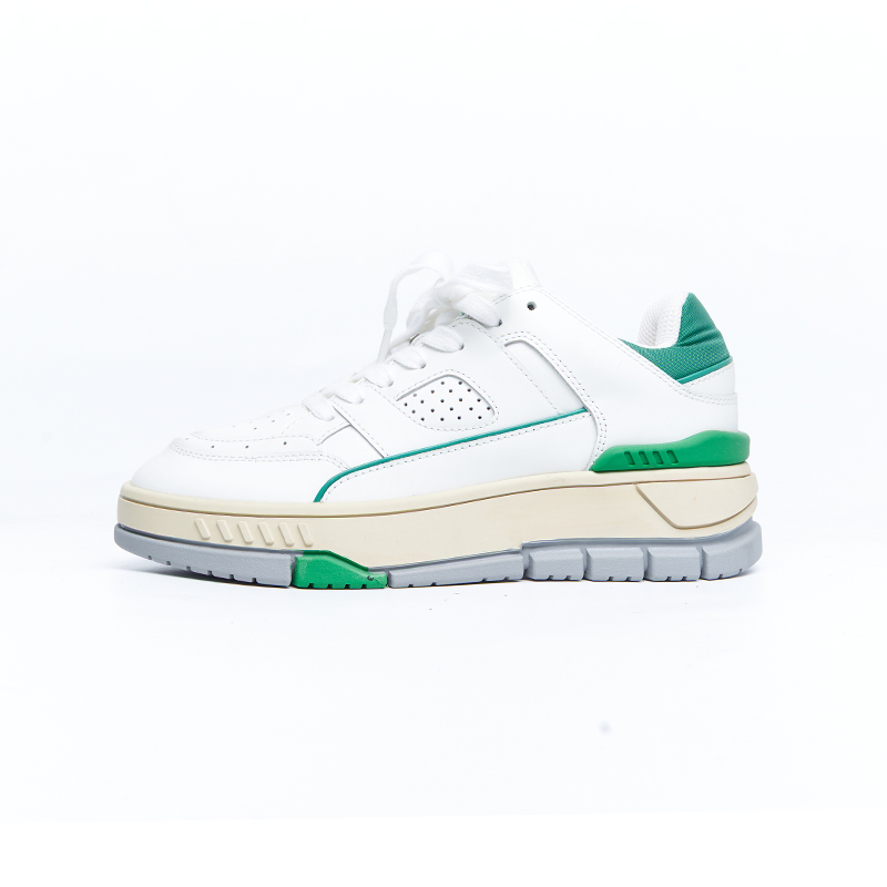 White and green low-top sneakers with layered leather upper and cushioned sole, developed for designer brands OEM ODM