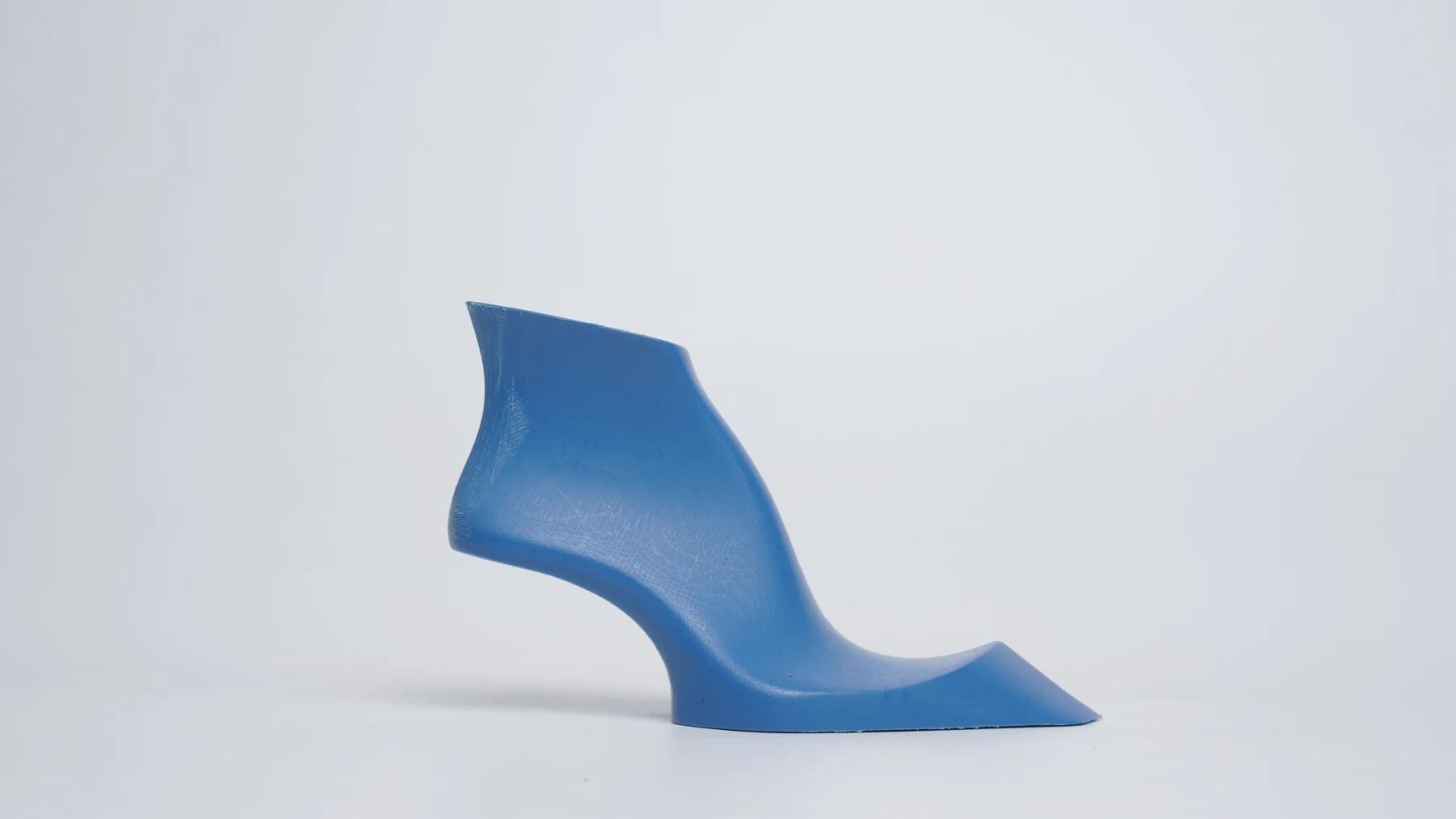 Blue sculptural footwear concept developed from an experimental silhouette